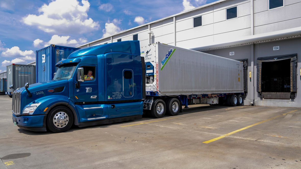 Navy Truck Backing Into Warehouse 2023 04