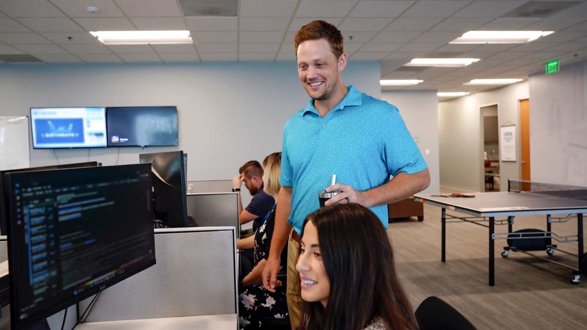 Brent And Sydney At Desk Web